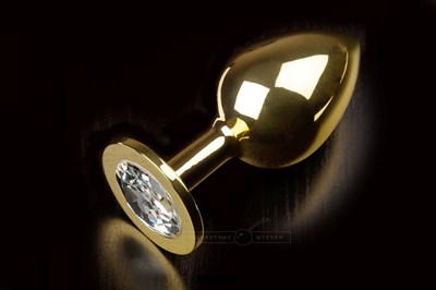 Большая золотая анальная пробка с закругленным кончиком и прозрачным кристаллом - 9 см. - фото 84672